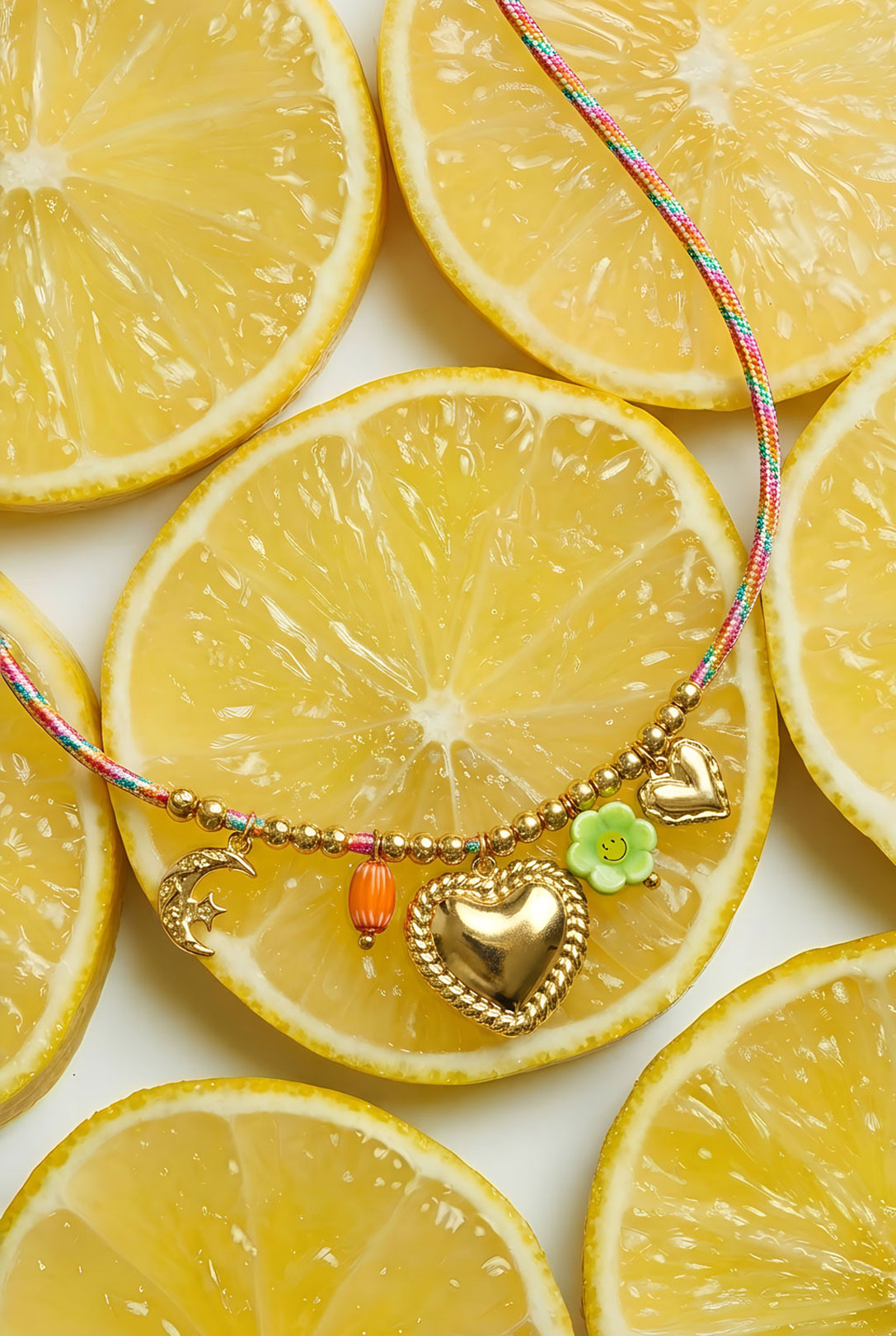 Colorful cord necklace with varying pendants