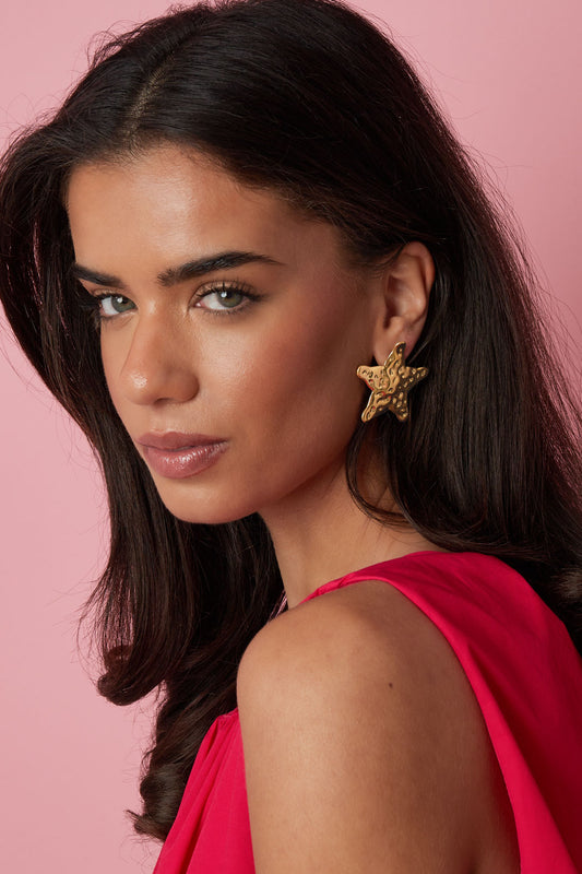 Dented star earrings
